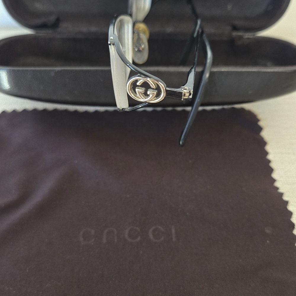 Gucci Black and Gold Rimless Eyewear with Interlocking G Accent